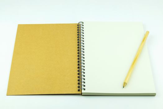 open notebook cover with pencil on white background