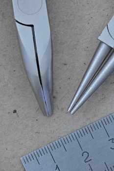 hand tool pliers and ruler macro shot