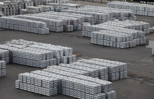Metal aluminum and titanium in ingots in the warehouse products