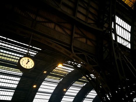 Architectural detail in Milan Central Station in Milan, Italy. Low angle view with dark shades and natural light from top.