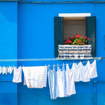 Burano Isle, close to Venice. Traditional colored houses during a sunny day.