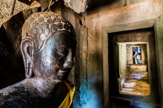 A carved buddha part of the ankor wat temple