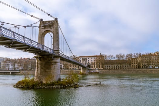 Old bridge over a river in a city