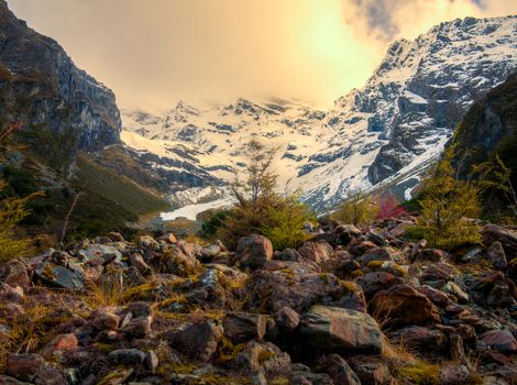 sunlight braking through some snowtoped mountains