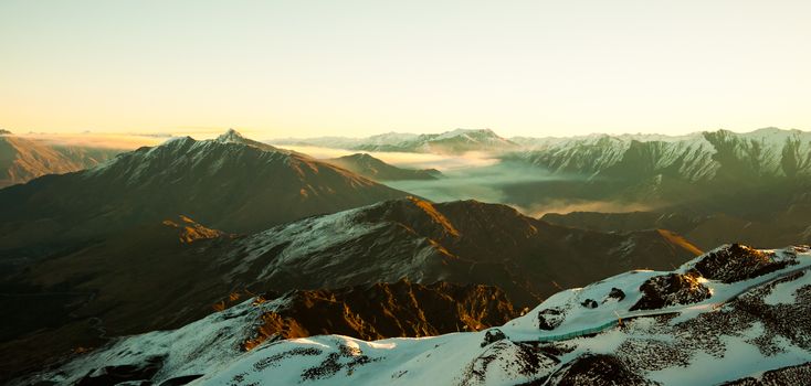 Mist sitting in the valleys of a mountain landscape