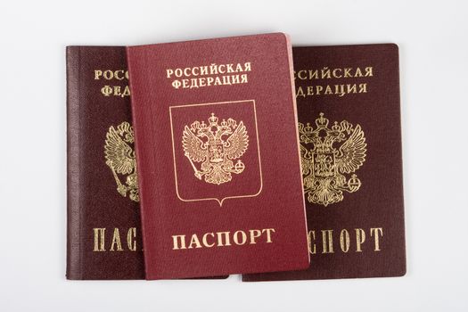 Three passport of the citizen of the Russian Federation on a white background