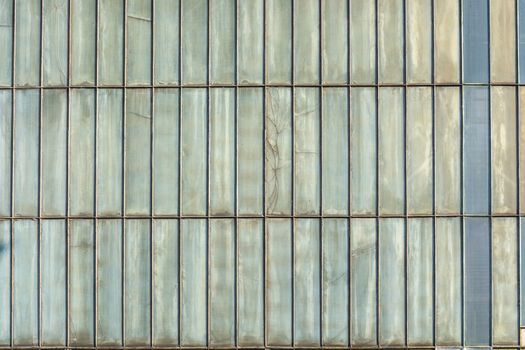 Silver-colored metal wall corrugated sheet metal background.