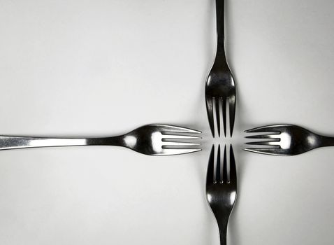 abstract background four forks in a cross
