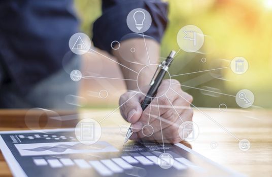 businessman hand working with new modern computer and business strategy as concept.