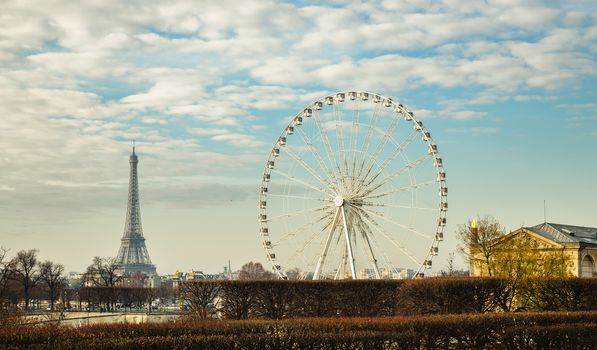 The ferris wheel and the Eiffel Tower in Paris, France