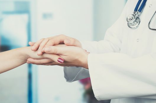 Doctor holding patient hand close up. doctor patient hand health care holding medical support concept