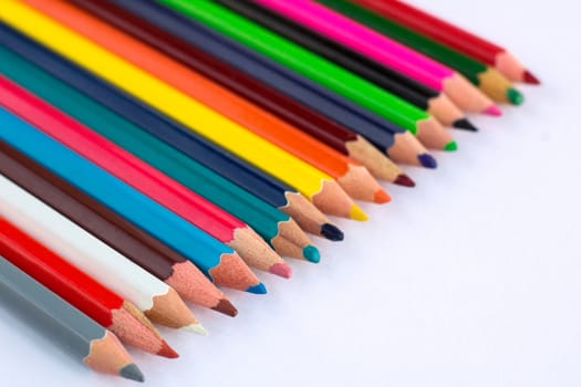 White background for presentation slide with colourful wooden pencils