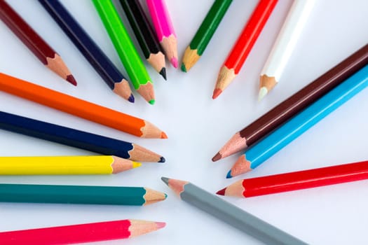 Colourful wooden pencils on white background with copy space