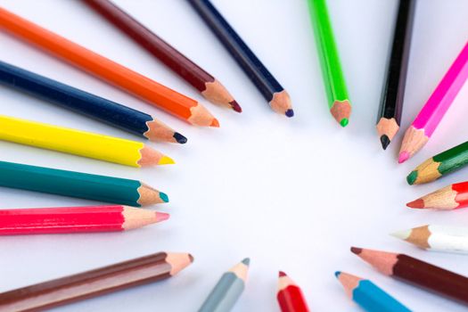 White background for presentation slide with colourful wooden pencils with circle copy space