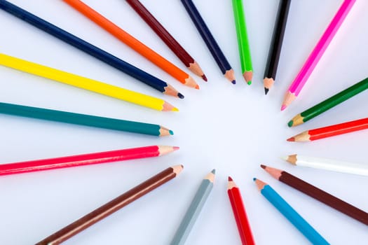 White background for presentation slide with colourful wooden pencils with circle copy space