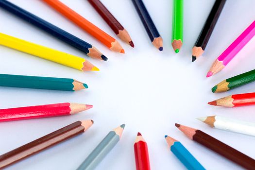 White background for presentation slide with colourful wooden pencils with circle copy space