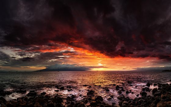 A dramatic sunset looking over the Pacific Ocean, Maui, Hawaii.