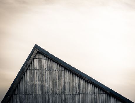 Minimalist Image Of An Industrial Sloping Factory Roof With Copy Space