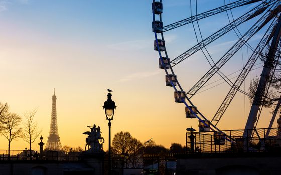 The ferris wheel and the Eiffel Tower in Paris, France