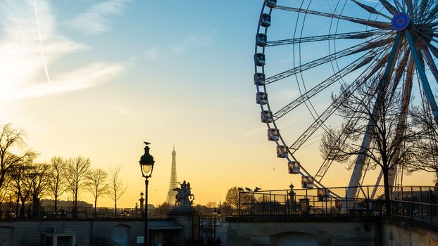 The ferris wheel and the Eiffel Tower in Paris, France