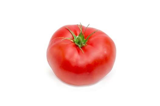 One ripe red tomato closeup on a light background
