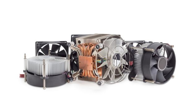 Several different active CPU coolers and fans different sizes for a computer case on a light background
