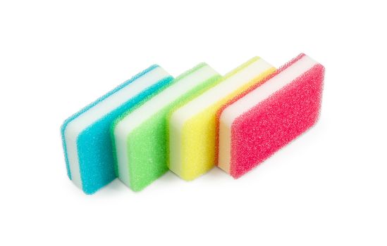 Several synthetic cleaning sponges with layer for more intense scrubbing different colors on a light background
