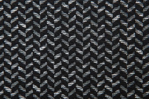 Black and white herringbone fabric pattern texture background closeup