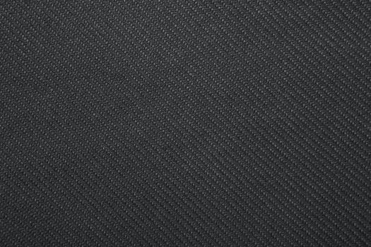 Black twill weave fabric pattern texture background closeup