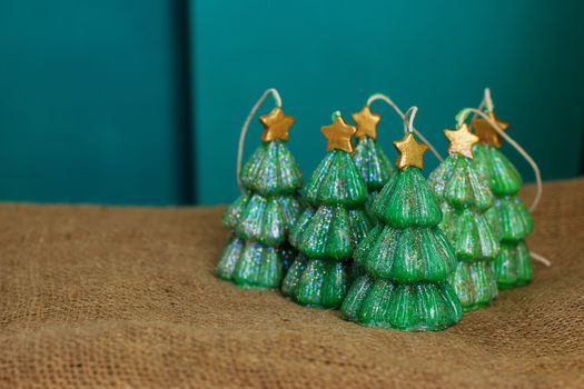 Green handmade Souvenir candles in the shape of Christmas trees