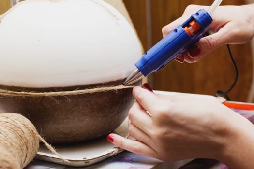 Female hands decorating handmade candles