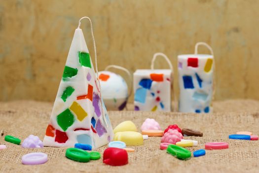 Decorative Handmade candles in the shape of a pyramid, cube, cylinder and sphere