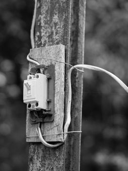 BLACK AND WHITE PHOTO OF SWITCH INSTALLED AT OUTSIDE