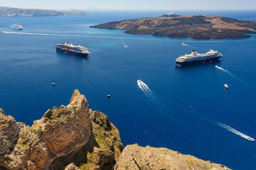 View from Fira coast to caldera sea with ships at background, Santorini Greece. Copyspace