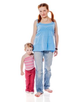 Mother standing with two years daughter isolated on white