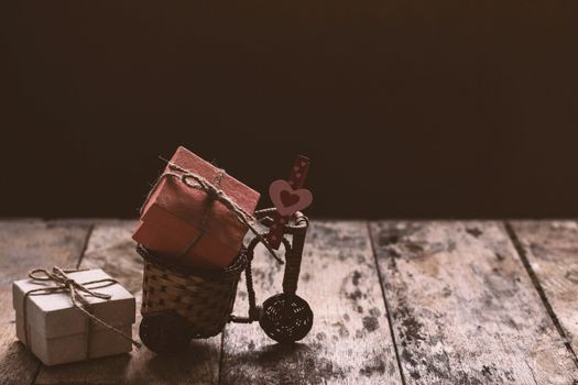 gift box and heart on a bicycle.