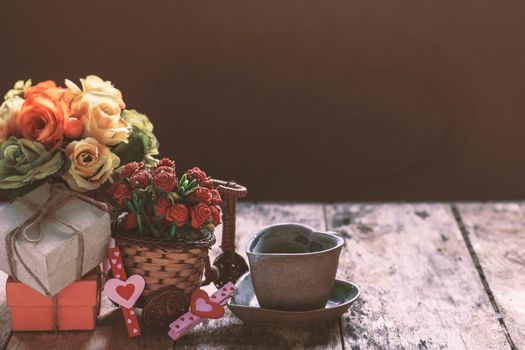 Gifts and cup on the old wooden floor.