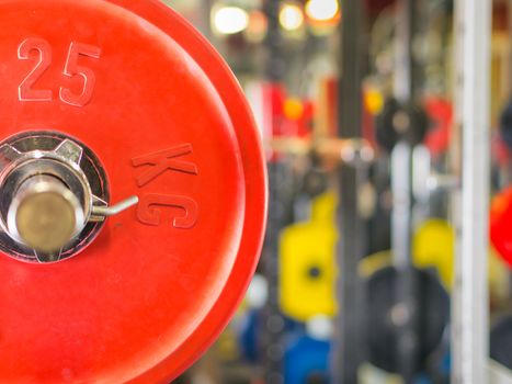 Barbell ready to workout in gym. Shallow DOF. Copy space. Sport or powerlifting background.