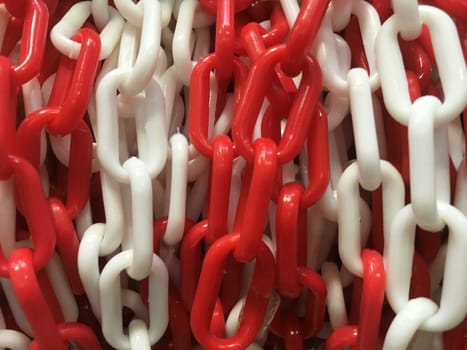 Closeup of plastic chain white and red.