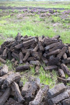 turf stacked up for the bog winds to dry in county kerry on the wild atlantic way of ireland