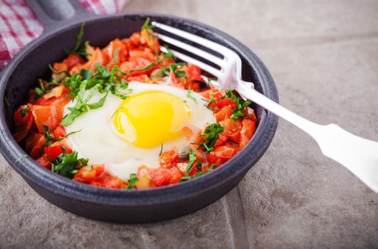 Traditional Middle Eastern dish of Shakshuka in a pan 