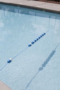 Dividing line between the shallow and deep ends of a clean swimming pool