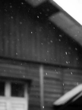 BLACK AND WHITE PHOTO OF BLURRY SHOT OF RAINDROPS