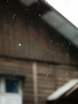 COLOR PHOTO OF BLURRY SHOT OF RAINDROPS