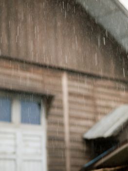 COLOR PHOTO OF BLURRY SHOT OF RAINDROPS