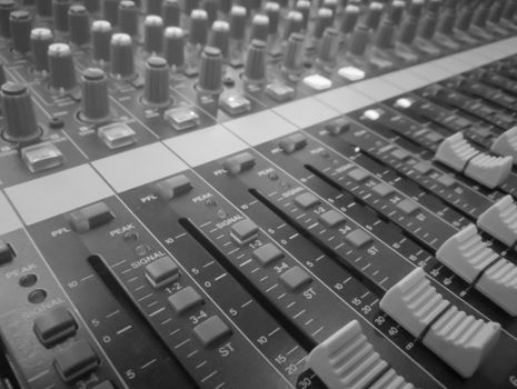 Closeup audio mixer, music equipment, monochrome picture