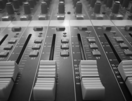 Closeup audio mixer, music equipment, monochrome picture