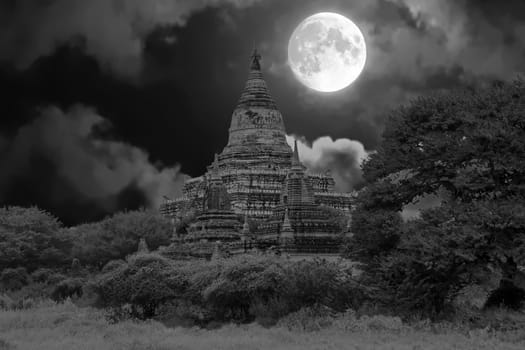 Ancient pagodas in the countryside from Bagan in Myanmar by full moon