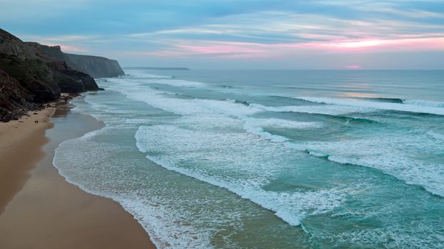 Aerial from a beautiful sunset at Vale Figueiras beach in Portugal