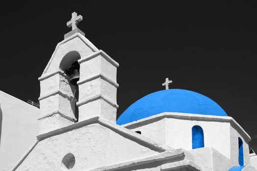 Detail of a church in Mykonos island, Greece on black and white with blue dome